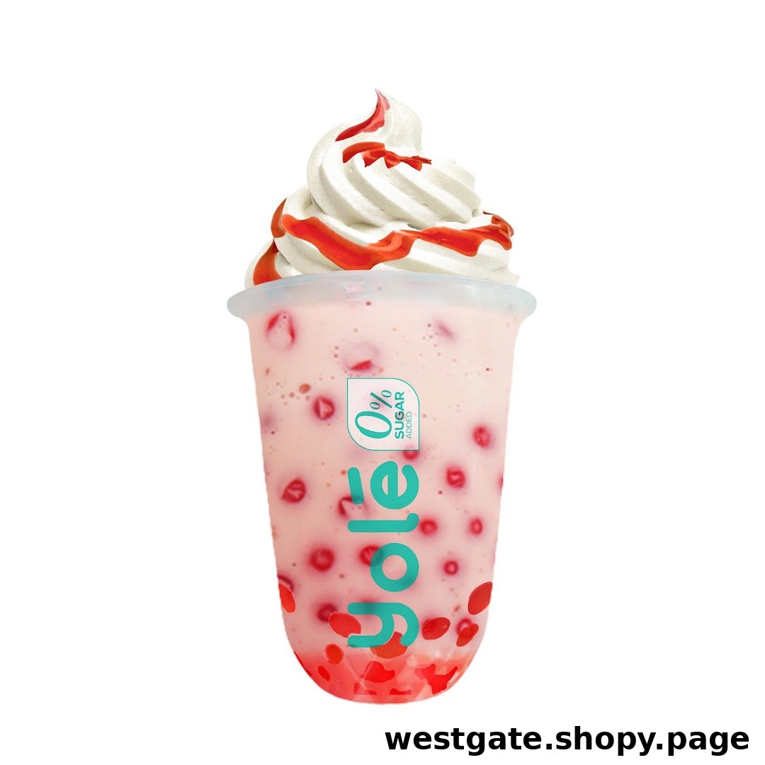 A refreshing pink drink with red fruit pieces, topped with creamy soft serve and strawberry syrup.