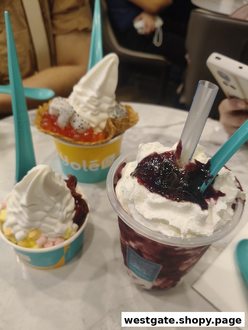 Delicious frozen yogurt desserts and a berry smoothie from Yolé Westgate.