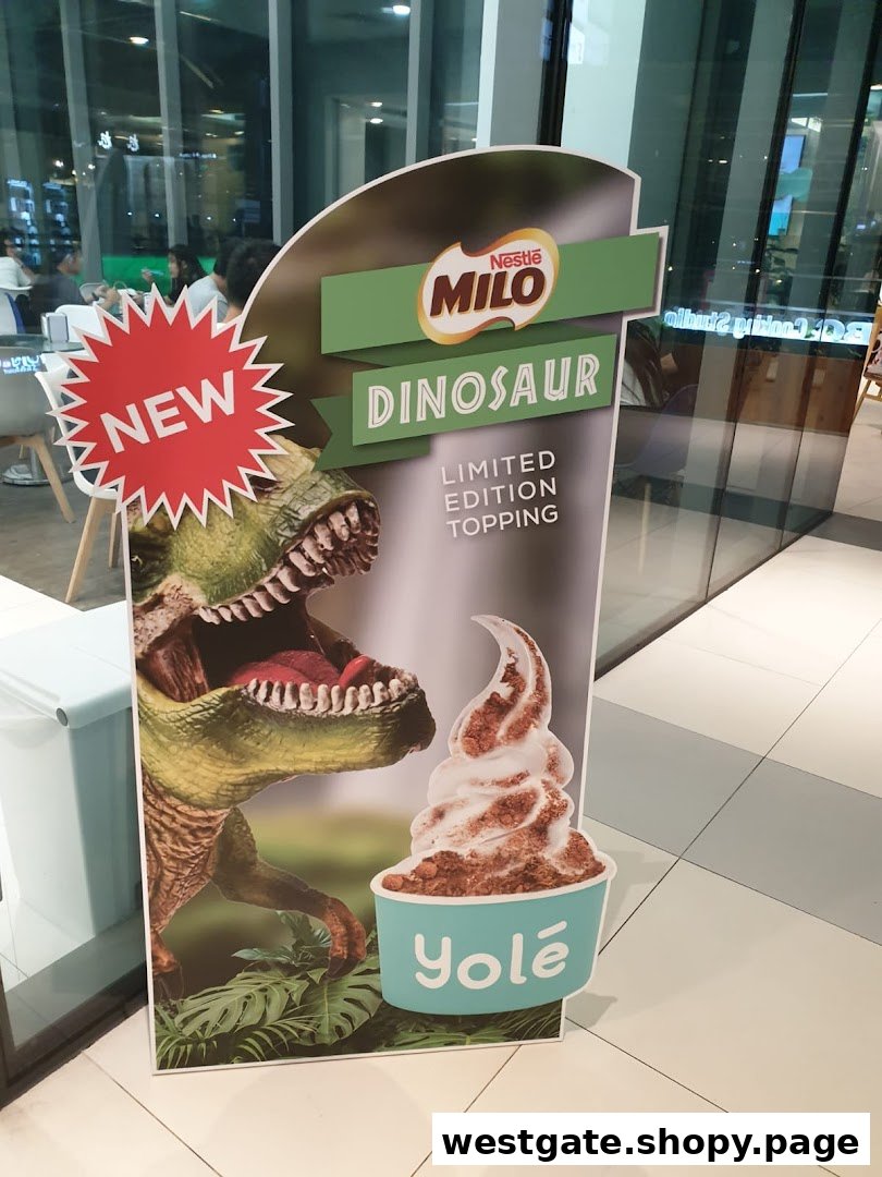 A promotional standee for Yolé's new Nestle Milo Dinosaur limited edition topping with a dinosaur graphic.