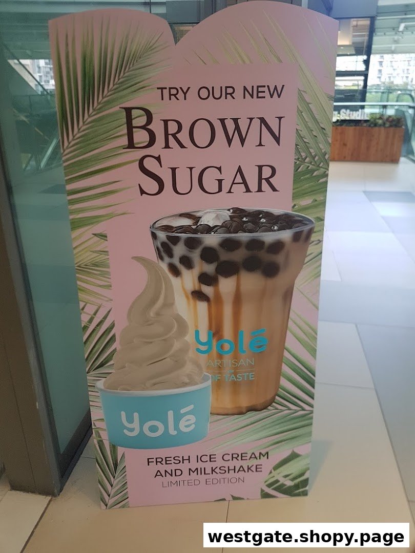 A promotional standee for Yolé featuring new Brown Sugar ice cream and milkshake, with tropical leaf design.