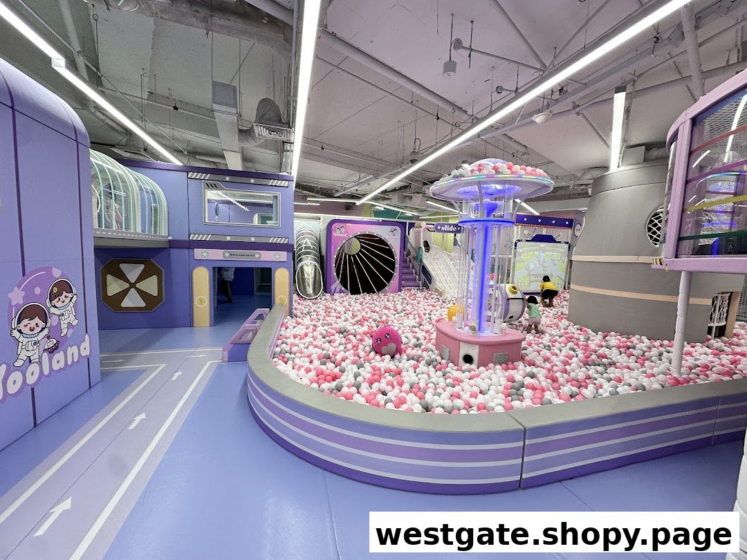 A vibrant indoor play area at Yooland featuring a large ball pit and space-themed structures.