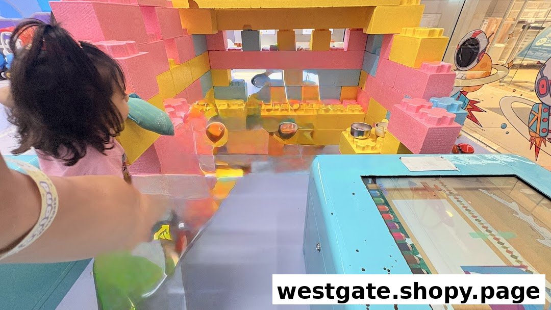 A child plays with colorful oversized building blocks in an interactive Yooland play area.
