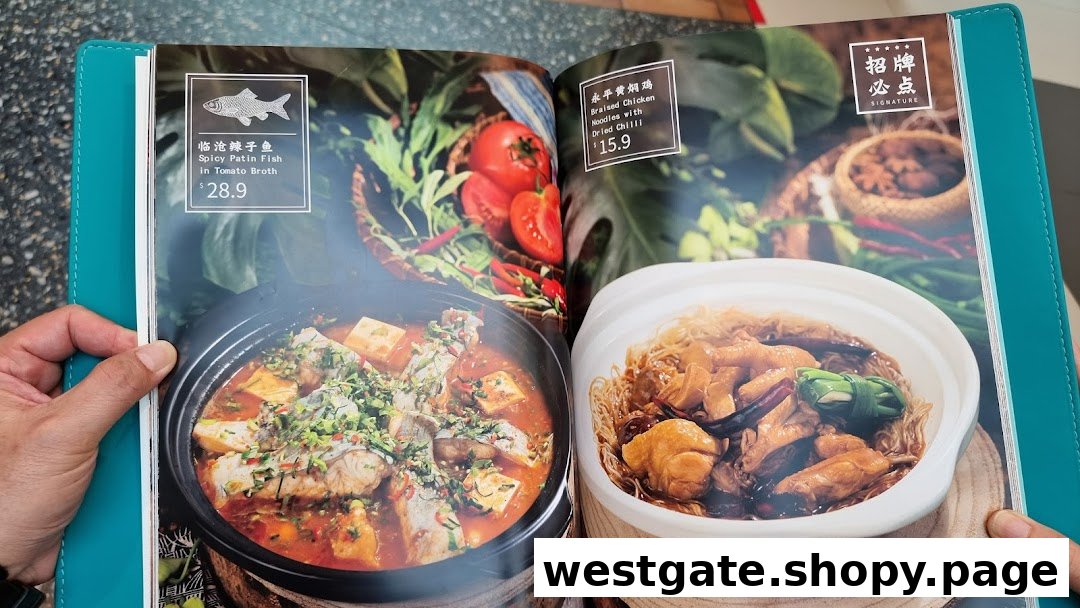 A close-up of a YUN NANS menu displaying two signature dishes with prices.