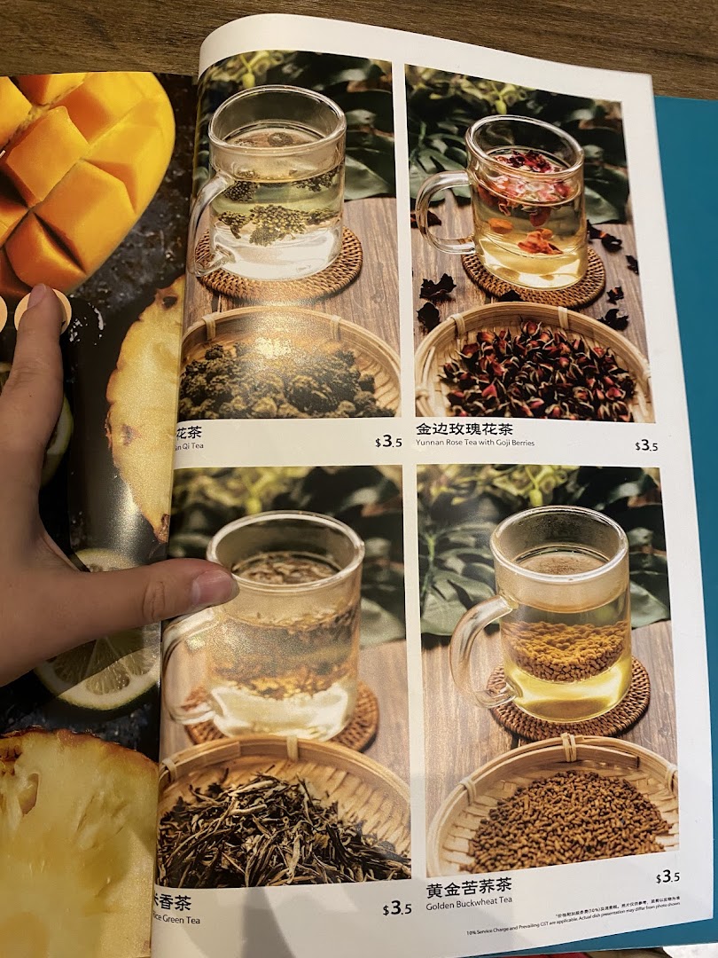 A menu page from YUN NANS featuring various tea selections with images, names, and prices.