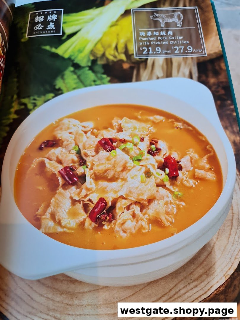 A menu page displaying a signature dish: Poached Pork Collar with Pickled Chillies.