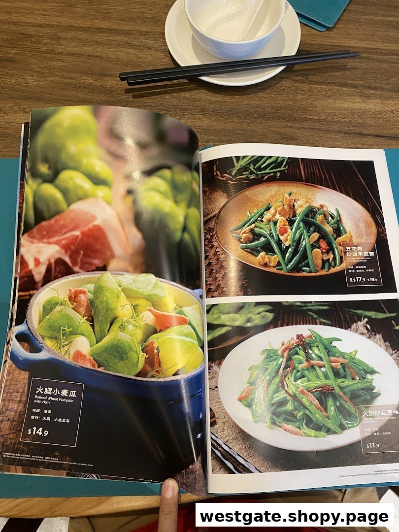 A menu page from YUN NANS Westgate showcasing various Yunnan dishes with images and prices.
