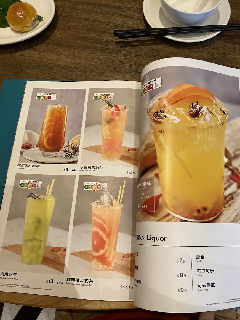 A vibrant menu page showcasing a variety of refreshing fruit teas and soft drinks with prices.
